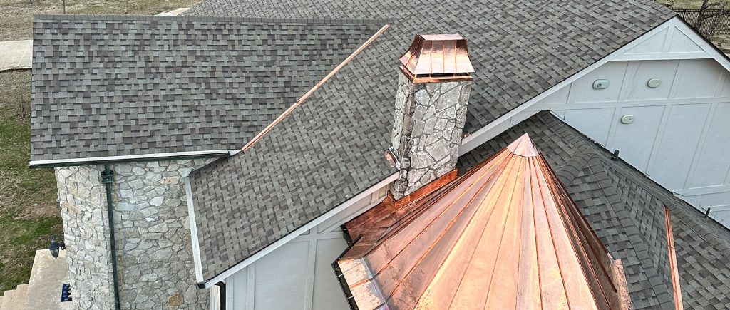 Image of a copper-topped spire on a roof, completed by Brose Construction.