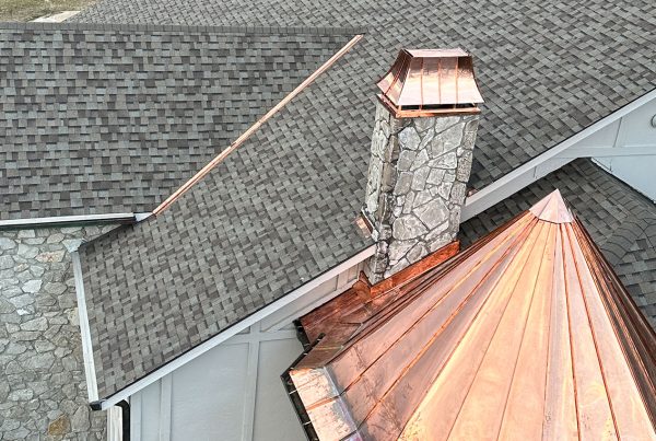 Image of a copper-topped spire on a roof, completed by Brose Construction.
