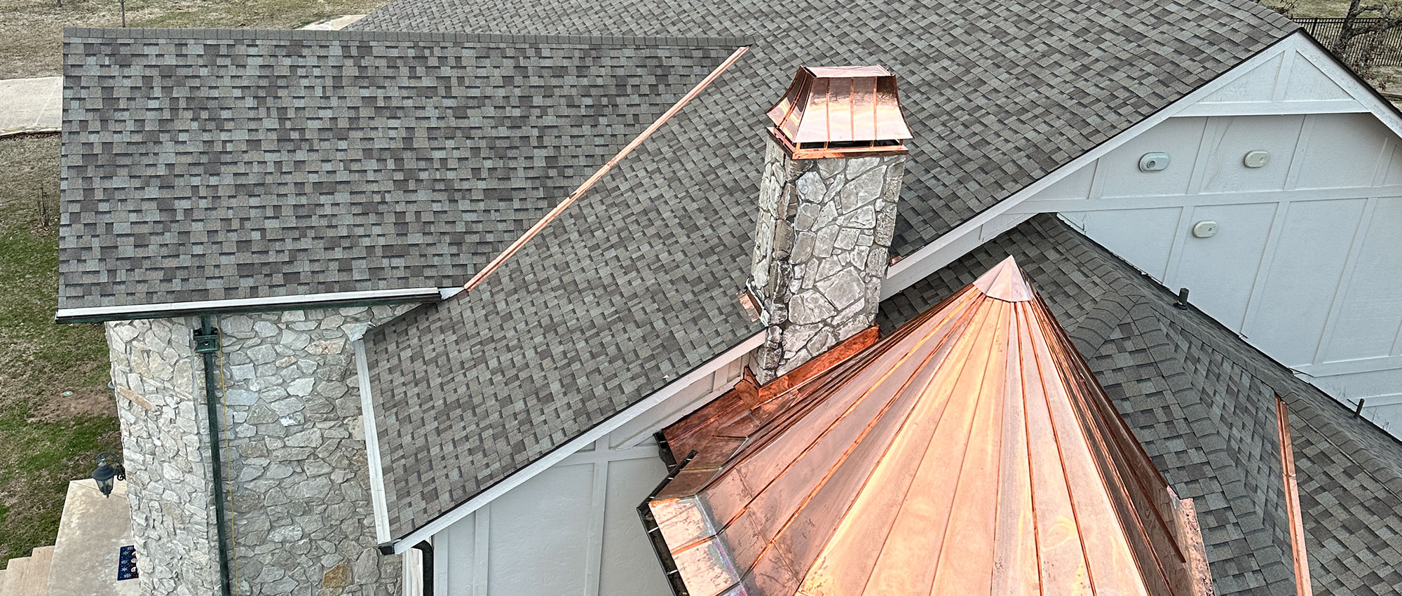 Image of a copper-topped spire on a roof, completed by Brose Construction.