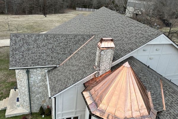 Image of a copper-topped spire on a roof, completed by Brose Construction.