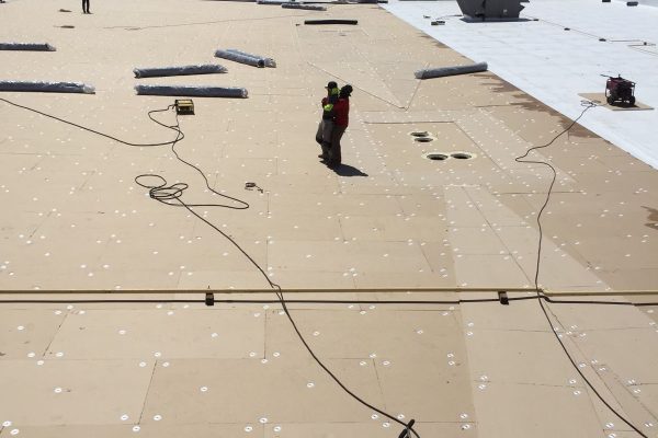 TPO roof membrane being installed by Brose Construction.