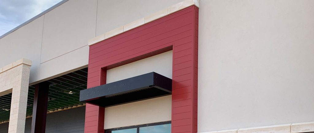 Extruded aluminum siding installed by Brose Construction.